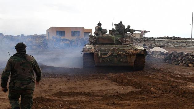 Syrian government forces gather in the village of Obeid, in the southern part of Aleppo province on Friday. (AFP Photo) Syrian government forces gather in the village of Obeid, in the southern part of Aleppo province on Friday. (AFP Photo)