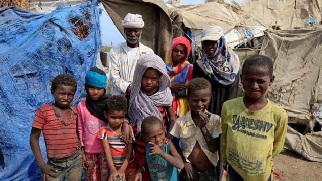Ayoub Mohammed Ruzaiq (R), and his family members pose outside their hut next to a garbage dump. The UN estimates more than two million have been displaced by the war in Yemen, which intensified in 2015 when an Arab coalition intervened to try restore President Abd-Rabbu Mansour Hadi to power after a Houthi forced exile. (Abduljabbar Zeyad / REUTERS) Ayoub Mohammed Ruzaiq (R), and his family members pose outside their hut next to a garbage dump. The UN estimates more than two million have been displaced by the war in Yemen, which intensified in 2015 when an Arab coalition intervened to try restore President Abd-Rabbu Mansour Hadi to power after a Houthi forced exile. (Abduljabbar Zeyad / REUTERS)