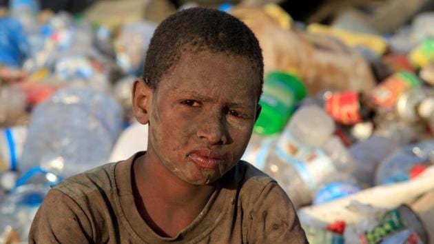 Ayoub Mohammed Ruzaiq, seen caked in dirt and grime from sifting through mounds of garbage. “We eat and drink the food that is thrown away,” described the 11-year-old. “We collect fish, meat, potatoes, onions and flour to make our own food.” (Abduljabbar Zeyad / REUTERS) Ayoub Mohammed Ruzaiq, seen caked in dirt and grime from sifting through mounds of garbage. “We eat and drink the food that is thrown away,” described the 11-year-old. “We collect fish, meat, potatoes, onions and flour to make our own food.” (Abduljabbar Zeyad / REUTERS)
