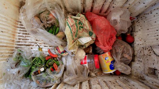 Odd bits and pieces of scavenged vegetables, tinned food and other ingredients are stored in a broken refrigerator, swarmed by flies, for future use by the 18-member Ruzaiq family. (Abduljabbar Zeyad / REUTERS) Odd bits and pieces of scavenged vegetables, tinned food and other ingredients are stored in a broken refrigerator, swarmed by flies, for future use by the 18-member Ruzaiq family. (Abduljabbar Zeyad / REUTERS)