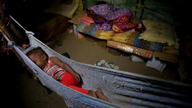 A girl sleeps in a hammock as her sister lies on a makeshift bed in the Ruzaiq family's hut. The Saudi-led coalition denies Houthi accusations that it targets civilians or civilian property in its operations --a root cause to this displacement. (Abduljabbar Zeyad / REUTERS) A girl sleeps in a hammock as her sister lies on a makeshift bed in the Ruzaiq family's hut. The Saudi-led coalition denies Houthi accusations that it targets civilians or civilian property in its operations --a root cause to this displacement. (Abduljabbar Zeyad / REUTERS)