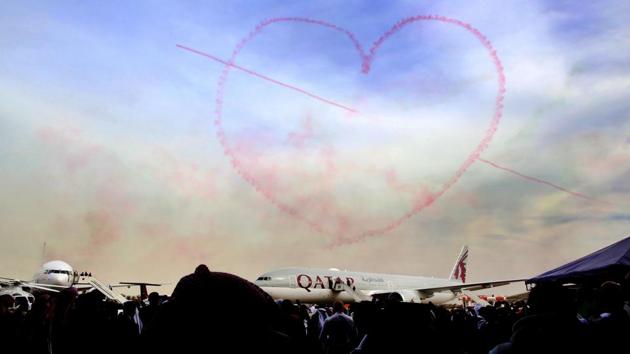 A smoky heart takes shape in the sky above a Qatar Airways plane during the Kuwait aviation show in Kuwait City on January 17. (Yasser Al-Zayyat / AFP) A smoky heart takes shape in the sky above a Qatar Airways plane during the Kuwait aviation show in Kuwait City on January 17. (Yasser Al-Zayyat / AFP)