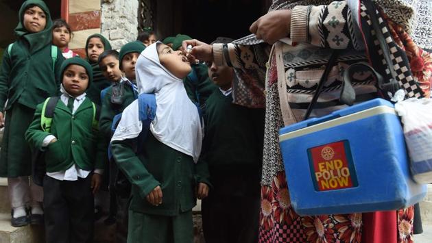 A Pakistani health worker administers polio vaccine drops to school children during a polio campaign in Lahore on January 15. Pakistan is one of only two countries in the world where polio remains endemic. (Arif Ali / AFP) A Pakistani health worker administers polio vaccine drops to school children during a polio campaign in Lahore on January 15. Pakistan is one of only two countries in the world where polio remains endemic. (Arif Ali / AFP)