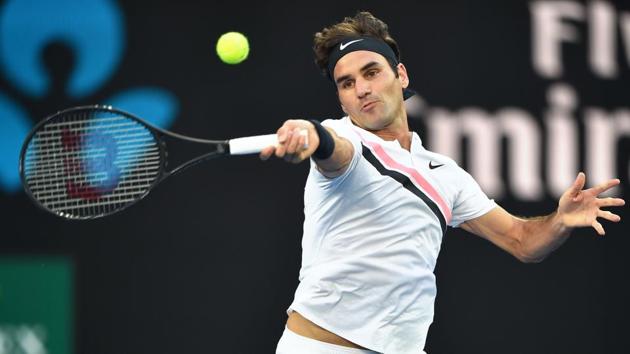 Switzerland's Roger Federer hits a return against Australia's Alex De Minaur during their men's singles first round match on day two of the Australian Open tennis tournament in Melbourne on January 16. (Peter Parks / AFP) Switzerland's Roger Federer hits a return against Australia's Alex De Minaur during their men's singles first round match on day two of the Australian Open tennis tournament in Melbourne on January 16. (Peter Parks / AFP)