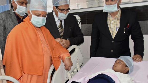 Uttar Pradesh chief minister Yogi Adityanath meets the class 1 student, who was stabbed by a senior girl in a Lucknow school, at King George's Medical University on Thursday. (PTI) Uttar Pradesh chief minister Yogi Adityanath meets the class 1 student, who was stabbed by a senior girl in a Lucknow school, at King George's Medical University on Thursday. (PTI)