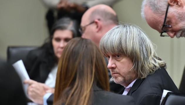 David Turpin confers with attorneys Allison Lowe (back of head) and David Macher (R) as Louise Turpin confers with attorney Jeff Moore, during his court arraignment with wife Louise in Riverside, California on January 18, 2018. (AFP) David Turpin confers with attorneys Allison Lowe (back of head) and David Macher (R) as Louise Turpin confers with attorney Jeff Moore, during his court arraignment with wife Louise in Riverside, California on January 18, 2018. (AFP)