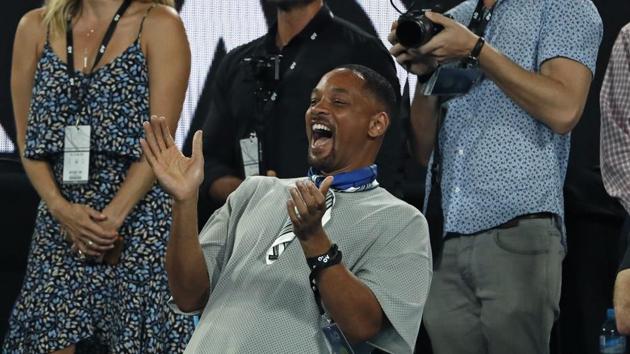 US actor Will Smith reacts after watching the third round match between France's Jo-Wilfried Tsonga and Australia's Nick Kyrgios. (AP) US actor Will Smith reacts after watching the third round match between France's Jo-Wilfried Tsonga and Australia's Nick Kyrgios. (AP)