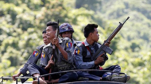 File photo of Myanmar police guarding a UN convoy.(Reuters)
