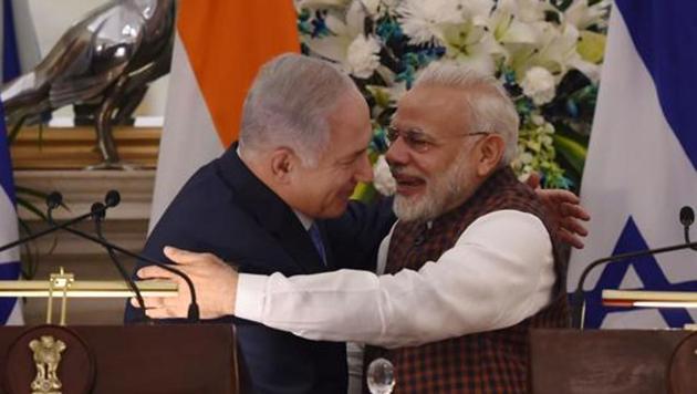 Indian Prime Minister Narendra Modi (R) hugs Israeli Prime Minister Benjamin Netanyahu during a press conference at Hyderabad House in New Delhi on January 15, 2018.(AFP File Photo)