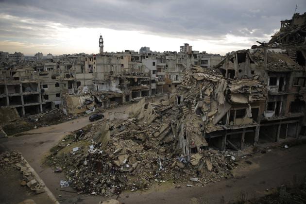 In this Tuesday, Jan. 16, 2018 photo, a car drives through a devastated part of the old city of Homs, Syria. (AP) In this Tuesday, Jan. 16, 2018 photo, a car drives through a devastated part of the old city of Homs, Syria. (AP)