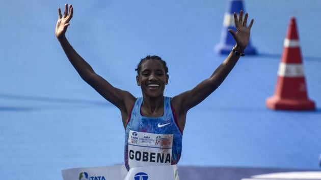 Ethiopia's Amane Gobena celebrates as she reaches the finish line. Solomon Deksisa and Amane Gobena made it a double delight for Ethiopia in this marathon by clinching the respective men’s and women’s races. (Kunal Patil / HT Photo)