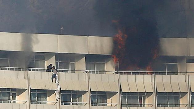 A man tries to escape from a balcony at Kabul's Intercontinental Hotel during an attack by gunmen in Kabul, Afghanistan. (Reuters Photo) A man tries to escape from a balcony at Kabul's Intercontinental Hotel during an attack by gunmen in Kabul, Afghanistan. (Reuters Photo)