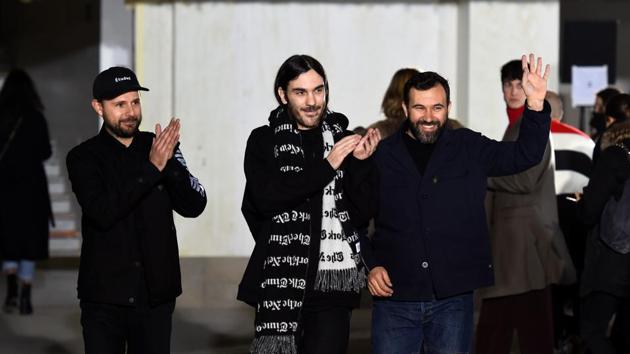 (L) Aurelien Arbet, Jeremie Egry, owners and Jose Lamali designer of Etudes studios, salute after the show during the men's Fashion Week for the Fall/Winter 2018/2019 collection in Paris. (AFP/Bertrand Guay) (L) Aurelien Arbet, Jeremie Egry, owners and Jose Lamali designer of Etudes studios, salute after the show during the men's Fashion Week for the Fall/Winter 2018/2019 collection in Paris. (AFP/Bertrand Guay)