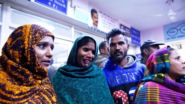 A woman mourns the death of a relative at a hospital after a two-storey cracker factory which caught fire in north Delhi's Bawana and 17 died. (PTI) A woman mourns the death of a relative at a hospital after a two-storey cracker factory which caught fire in north Delhi's Bawana and 17 died. (PTI)