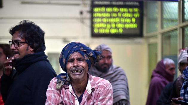 A man wails as he awaits news about his relative at a hospital after a two-storey cracker factory caught fire in north Delhi's Bawana Industrial Area. At least 17 died . (PTI) A man wails as he awaits news about his relative at a hospital after a two-storey cracker factory caught fire in north Delhi's Bawana Industrial Area. At least 17 died . (PTI)