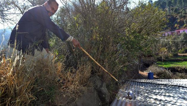 A local shows the remains of a mortar shell fired from Pakistan side near the Line of Control (LoC) in Poonch district on Saturday. (PTI Photo) A local shows the remains of a mortar shell fired from Pakistan side near the Line of Control (LoC) in Poonch district on Saturday. (PTI Photo)