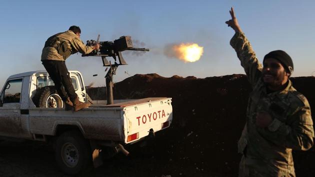 Turkish-backed fighters from the Free Syrian Army stand in the Tal Malid area, north of Aleppo, as they fire towards Kurdish People’s Protection Units positions in Afrin, on Saturday. (AFP Photo) Turkish-backed fighters from the Free Syrian Army stand in the Tal Malid area, north of Aleppo, as they fire towards Kurdish People’s Protection Units positions in Afrin, on Saturday. (AFP Photo)