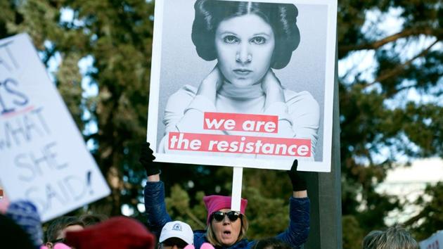 A paticipant holds u pa sign during the Denver's Women's March in Denver, Colorado. (AFP Photo) A paticipant holds u pa sign during the Denver's Women's March in Denver, Colorado. (AFP Photo)