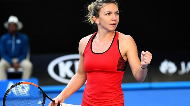 Simona Halep celebrates her win over Naomi Osaka in the fourth round of the Australian Open at Melbourne Park on Monday. (Getty Images) 