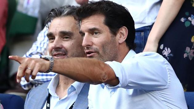 Former Aussie Formula 1 driver Mark Webber (right) watches the Australian Open fourth round match between Novak Djokovic and Chung Hyeon. (Getty Images) 