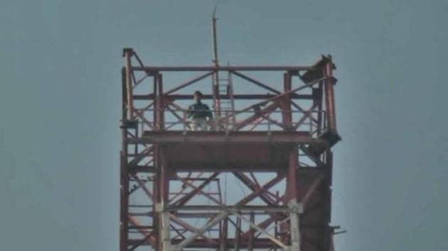 A youth on Monday climbed a 350 feet tall mobile tower with a bottle of petrol in Bhilwara to protest against the release of the film Padmavaat in Rajasthan. Further, the Supreme Court said today it will hear appeals by the governments in Rajasthan and Madhya Pradesh tomorrow, to modify its order that allowed the film to be released in theatres across India on January 25. (ANI) A youth on Monday climbed a 350 feet tall mobile tower with a bottle of petrol in Bhilwara to protest against the release of the film Padmavaat in Rajasthan. Further, the Supreme Court said today it will hear appeals by the governments in Rajasthan and Madhya Pradesh tomorrow, to modify its order that allowed the film to be released in theatres across India on January 25. (ANI)