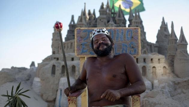 They say a man’s home is his castle and Marcio Matolias has lived in his - albeit made of sand - on a beach in Rio de Janeiro for the past 22 years. In Barra da Tijuca, a wealthy beachside neighbourhood, neighbours and friends call him “The King”. He gladly assumes the role and poses willingly for passers-by, sceptre in hand, on his throne outside his meticulously-sculpted home. (Mauro Pimentel / AFP) They say a man’s home is his castle and Marcio Matolias has lived in his - albeit made of sand - on a beach in Rio de Janeiro for the past 22 years. In Barra da Tijuca, a wealthy beachside neighbourhood, neighbours and friends call him “The King”. He gladly assumes the role and poses willingly for passers-by, sceptre in hand, on his throne outside his meticulously-sculpted home. (Mauro Pimentel / AFP)