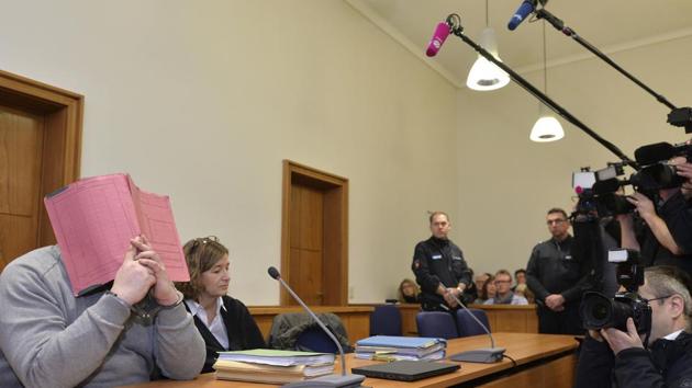 In this Feb 26, 2015 file photo, former nurse Niels Hoegel, accused of multiple murder and attempted murder of patients, covers his face with a file at the district court in Oldenburg, Germany. (AP Photo) In this Feb 26, 2015 file photo, former nurse Niels Hoegel, accused of multiple murder and attempted murder of patients, covers his face with a file at the district court in Oldenburg, Germany. (AP Photo)