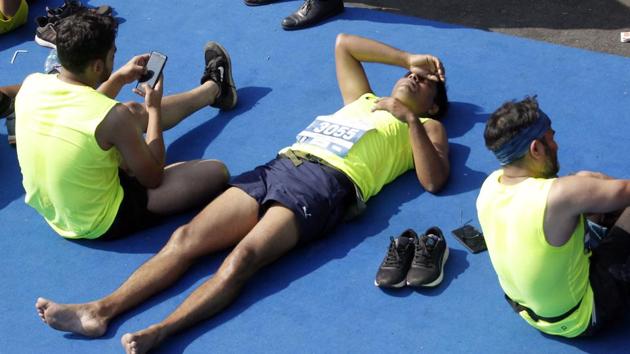 Exhausted marathoners after the run. (HT FILE) Exhausted marathoners after the run. (HT FILE)
