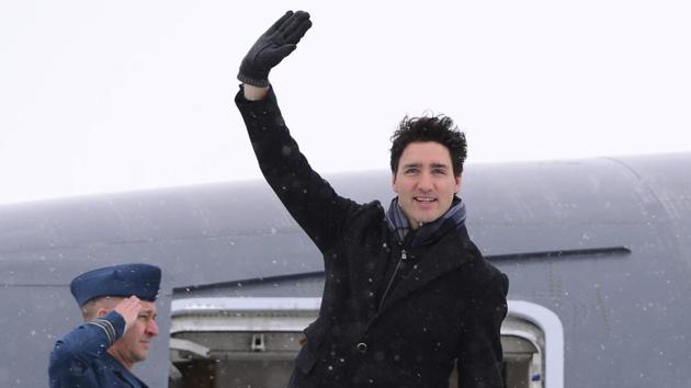 Canadian Prime Minister Justin Trudeau waves from the steps of his plane as he departs Ottawa, Ontario, for Davos, Switzerland, for the annual World Economic Forum on January 22, 2018. (AP) Canadian Prime Minister Justin Trudeau waves from the steps of his plane as he departs Ottawa, Ontario, for Davos, Switzerland, for the annual World Economic Forum on January 22, 2018. (AP)
