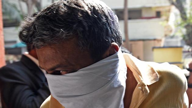 Fire officer Rajendra B Patil, 52, was produced in the court on Sunday. (Satyabrata Tripathy/HT Photo) Fire officer Rajendra B Patil, 52, was produced in the court on Sunday. (Satyabrata Tripathy/HT Photo)