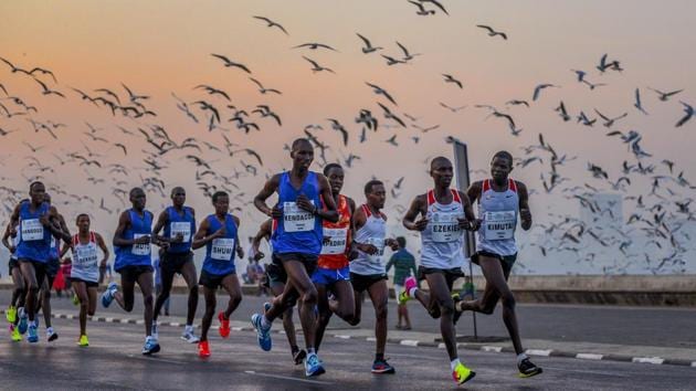 International participants seen along Marine Drive during the marathon. While the full marathon spanned a course of 42.1km, shorter half-marathons and special categories for senior citizens and differently-abled ensured greater participation than ever. (Satyabrata Tripathy / HT Photo)