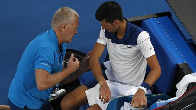 Novak Djokovic gets treatment during the match against Chung Hyeon at the Australian Open tennis championships in Melbourne on Monday. (AP) Novak Djokovic gets treatment during the match against Chung Hyeon at the Australian Open tennis championships in Melbourne on Monday. (AP)