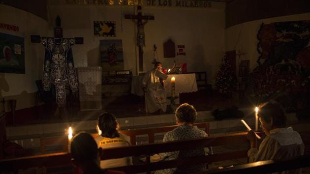 Pablo’s congregation celebrates Mass in candlelight during a power outage. He tends to some of the rainforest’s most hapless souls. Men from poor villages who scour mercury-laced rivers for gold, women who sell their bodies in the brothels near illegal mining camps and people like Juan Peralta, who was shot dead in a dispute with an indigenous tribe with no relatives to mourn him. (Rodrigo Abd / AP) Pablo’s congregation celebrates Mass in candlelight during a power outage. He tends to some of the rainforest’s most hapless souls. Men from poor villages who scour mercury-laced rivers for gold, women who sell their bodies in the brothels near illegal mining camps and people like Juan Peralta, who was shot dead in a dispute with an indigenous tribe with no relatives to mourn him. (Rodrigo Abd / AP)