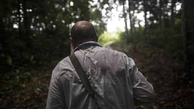 Pablo Zabala makes his way through the jungle under heavy rain to the rural home of a parishioner. After 10 years of service here, the Spanish priest has been transferred 130 kms (80 miles) away to Puerto Maldonado, known as the gateway to the Amazon jungle. (Rodrigo Abd / AP) Pablo Zabala makes his way through the jungle under heavy rain to the rural home of a parishioner. After 10 years of service here, the Spanish priest has been transferred 130 kms (80 miles) away to Puerto Maldonado, known as the gateway to the Amazon jungle. (Rodrigo Abd / AP)