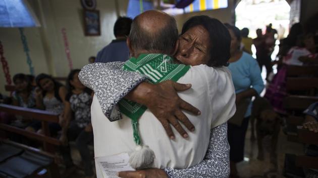 Parishioner Lucero Fatima Cusi embraces Father Pablo Zabala in Boca Colorado. Small-scale miners like the ones Zabala comforts are a major driver of the colonization that fuels the forest degradation and pollutes the rivers. But in spite of Zabala’s work, Pope Francis is not a popular figure among the miners who associate him with their enemies: ecologists. (Rodrigo Abd / AP) Parishioner Lucero Fatima Cusi embraces Father Pablo Zabala in Boca Colorado. Small-scale miners like the ones Zabala comforts are a major driver of the colonization that fuels the forest degradation and pollutes the rivers. But in spite of Zabala’s work, Pope Francis is not a popular figure among the miners who associate him with their enemies: ecologists. (Rodrigo Abd / AP)
