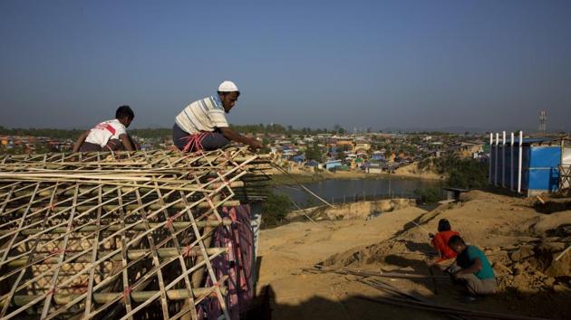 In this Friday, Jan. 19, 2018, photo, a Rohingya father and son makes their temporary shelter at Kutupalong refugee centre, near Cox's Bazar, Bangladesh. (AP) In this Friday, Jan. 19, 2018, photo, a Rohingya father and son makes their temporary shelter at Kutupalong refugee centre, near Cox's Bazar, Bangladesh. (AP)