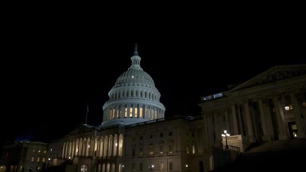 The US Capitol at night after the Senate was adjourned on Saturday. (AFP) The US Capitol at night after the Senate was adjourned on Saturday. (AFP)
