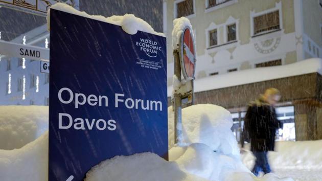 A person passes a sign for the Open Forum Davos of the World Economic Forum (WEF) 2018 annual meeting on January 21, 2018 in Davos, eastern Switzerland. (AFP Photo) A person passes a sign for the Open Forum Davos of the World Economic Forum (WEF) 2018 annual meeting on January 21, 2018 in Davos, eastern Switzerland. (AFP Photo)