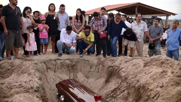 Relatives of Mexican journalist Carlos Dominguez Rodriguez, who was murdered on January 13, attend his funeral in the cemetery, Guerrero state. (AFP Photo) Relatives of Mexican journalist Carlos Dominguez Rodriguez, who was murdered on January 13, attend his funeral in the cemetery, Guerrero state. (AFP Photo)