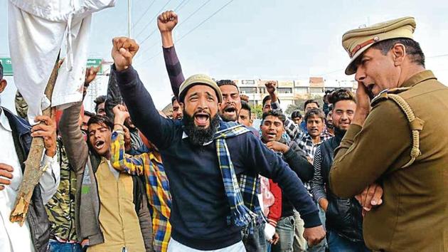 Kin of Ramzan Mohammad (right) blocking the Mansa Devi Complex road in Panchkula on Monday. They demanded the dismissal and arrest of the policemen whose brutality landed the 64-year-old in GMCH-32, Chandigarh, with severe injuries on the hip. (Sant Arora/HT) Kin of Ramzan Mohammad (right) blocking the Mansa Devi Complex road in Panchkula on Monday. They demanded the dismissal and arrest of the policemen whose brutality landed the 64-year-old in GMCH-32, Chandigarh, with severe injuries on the hip. (Sant Arora/HT)