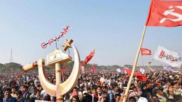 CPI(M) activists hold flags and huge party symbol in an open rally at Bridge Parade Ground in Kolkata. (PTI File Photo) CPI(M) activists hold flags and huge party symbol in an open rally at Bridge Parade Ground in Kolkata. (PTI File Photo)