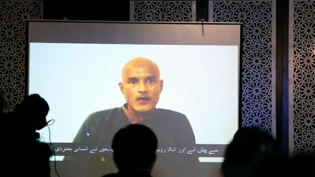 Former navy officer Kulbhushan Jadhav is seen on a screen during a news conference at the ministry of Foreign Affairs in Islamabad, Pakistan on December 25, 201.(Reuters)