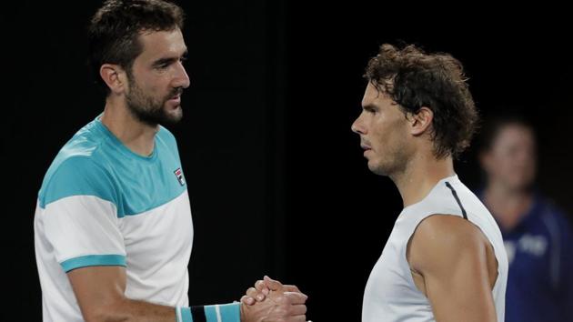 Rafael Nadal, right, is consoled by Marin Cilic after he withdrew injured from their Australian Open quarterfinal match (AP) Rafael Nadal, right, is consoled by Marin Cilic after he withdrew injured from their Australian Open quarterfinal match (AP)