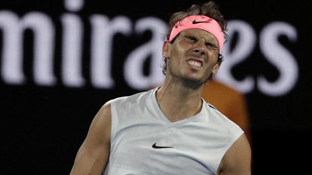 Rafael Nadal grimaces in pain during his Australian Open quarter-final against Marin Cilic on Tuesday. (AP)