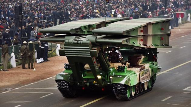 A Bridge Layer Tank T-72 ambles down Rajpath. The celebrations are also a projection of military might and feature appearances by missile batteries, heavy tanks, armament and ground technology displays. (Mohd Zakir / HT Photo) 