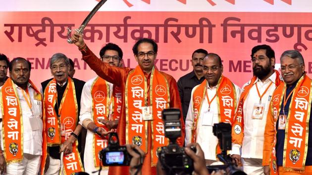 Uddhav Thackarey holds a sword along with Shiv Sena party leader. (Anshuman Poyrekar/HT Photo) Uddhav Thackarey holds a sword along with Shiv Sena party leader. (Anshuman Poyrekar/HT Photo)