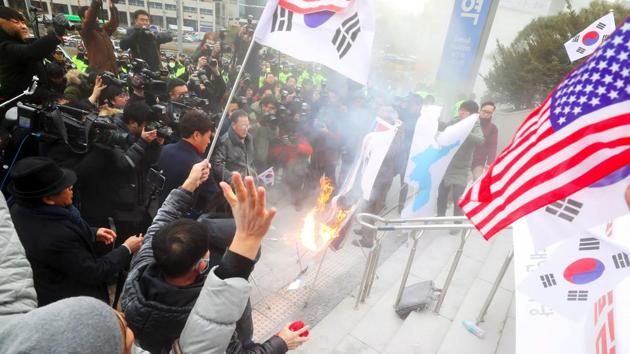 South Korean protestors burn a picture of North Korean leader Kim Jong-Un during an anti-North Korea rally outside Seoul station in Seoul on January 22. (AFP Photo) South Korean protestors burn a picture of North Korean leader Kim Jong-Un during an anti-North Korea rally outside Seoul station in Seoul on January 22. (AFP Photo)