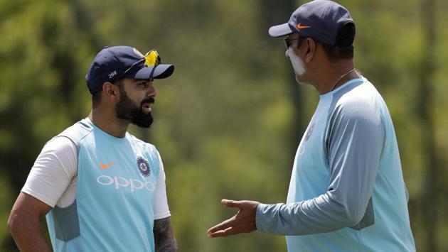India captain Virat Kohli, left, chats with coach Ravi Shastri during a practice session at the Wanderers Stadium in Johannesburg ahead of the third Test against South Africa. (AP) India captain Virat Kohli, left, chats with coach Ravi Shastri during a practice session at the Wanderers Stadium in Johannesburg ahead of the third Test against South Africa. (AP)