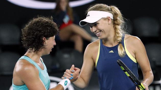 Denmark's Caroline Wozniacki shakes hands with Spain's Carla Suarez Navarro after winning the Australian Open semi-finals. (REUTERS) Denmark's Caroline Wozniacki shakes hands with Spain's Carla Suarez Navarro after winning the Australian Open semi-finals. (REUTERS)