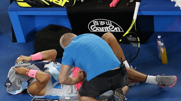 Nadal receives medical assistance during his match against Marin Cilic. (REUTERS) Nadal receives medical assistance during his match against Marin Cilic. (REUTERS)